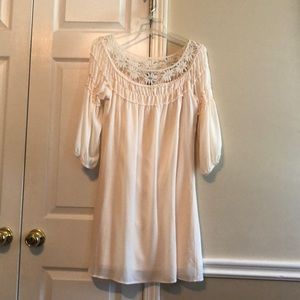 Cream color dress. Lace neckline.